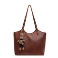 Soft Vegan Leather Tote with Adjustable Straps & Plush Charm