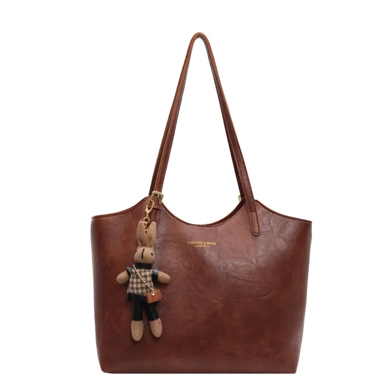 Soft Vegan Leather Tote with Adjustable Straps & Plush Charm