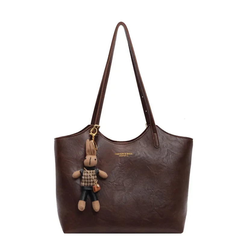 Soft Vegan Leather Tote with Adjustable Straps & Plush Charm
