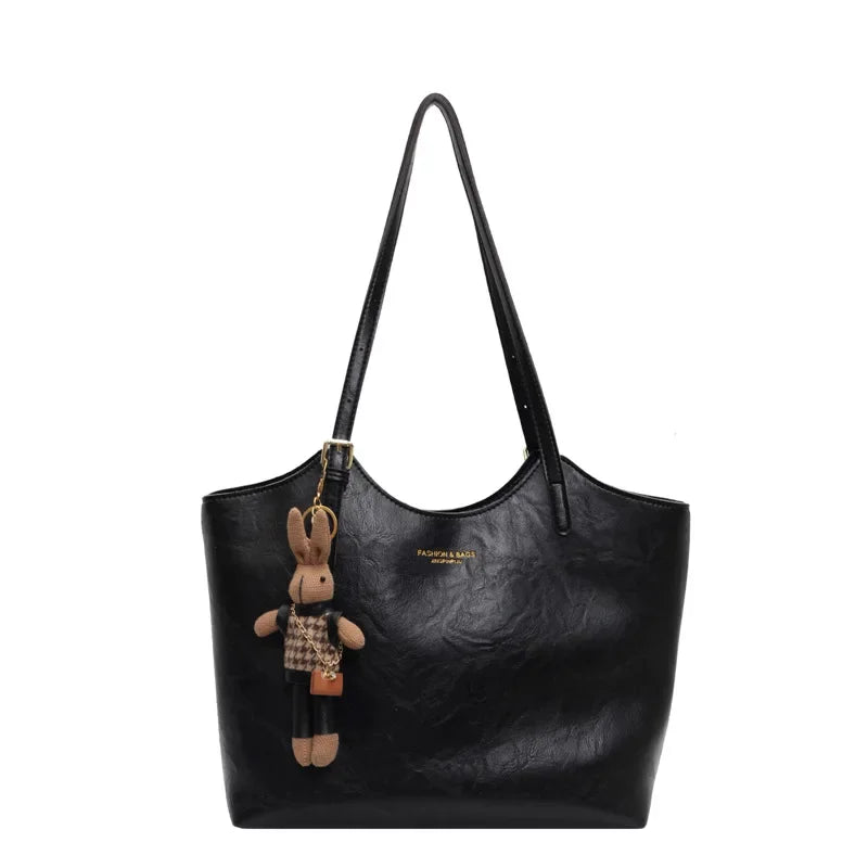 Soft Vegan Leather Tote with Adjustable Straps & Plush Charm